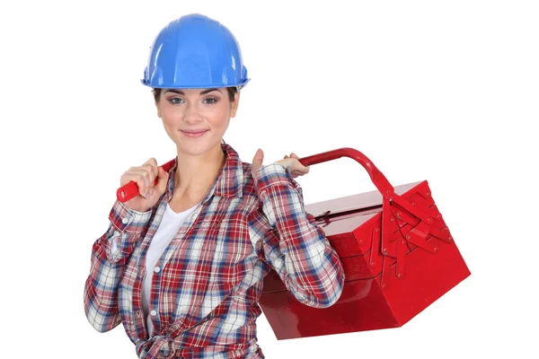 Uma mulher à mão segurando uma caixa de ferramentas . — Fotografia de Stock