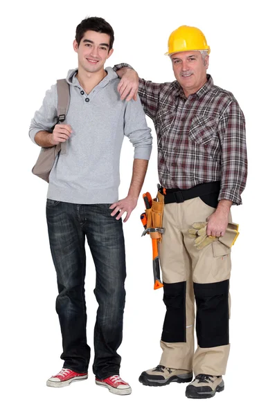Craftsman and apprentice posing together — Stock Photo, Image