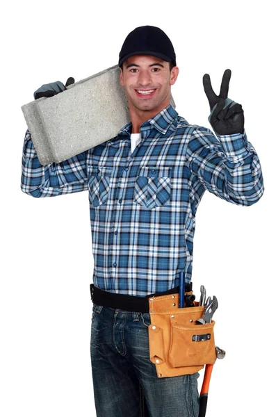 Bricklayer making peace gesture — Stock Photo, Image