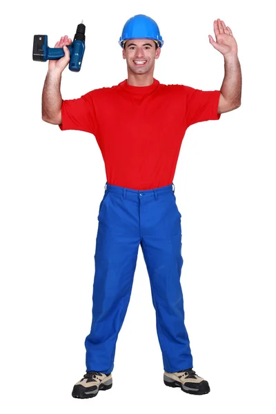 Homem com braços levantados e broca — Fotografia de Stock