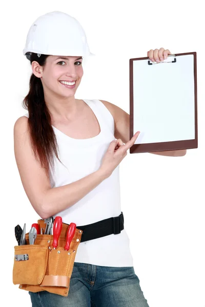 Costruttore femminile con un blocco appunti — Foto Stock