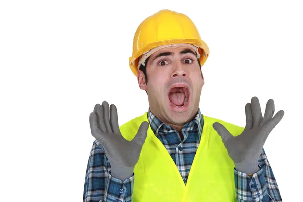 Trabajador de la construcción soltando un grito de horror — Foto de Stock