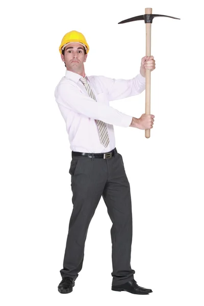 Full-body portrait of architect holding pickaxe — Stock Photo, Image