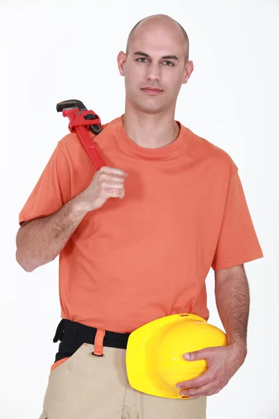Man with an adjustable wrench — Stock Photo, Image