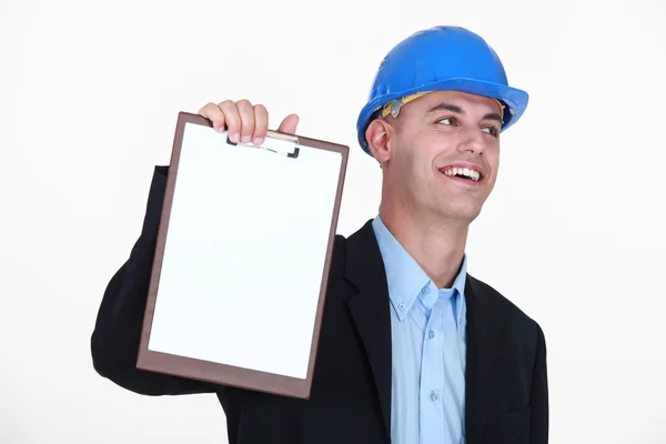 An architect presenting a clipboard. — Stock Photo, Image