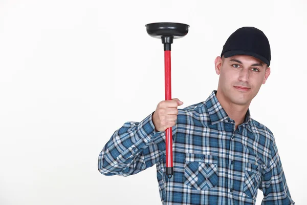 Plumber holding plunger — Stock Photo, Image