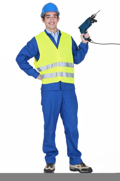 Cheerful builder holding drill — Stock Photo, Image