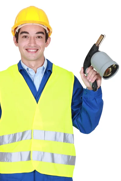 Worker holding blow torch — Stock Photo, Image