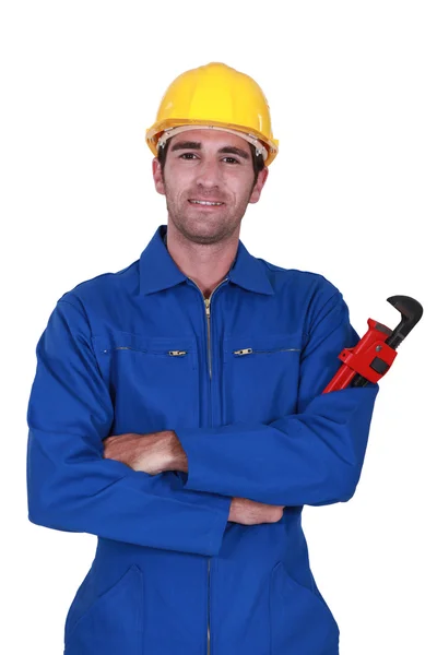 Constructor sosteniendo llave roja —  Fotos de Stock