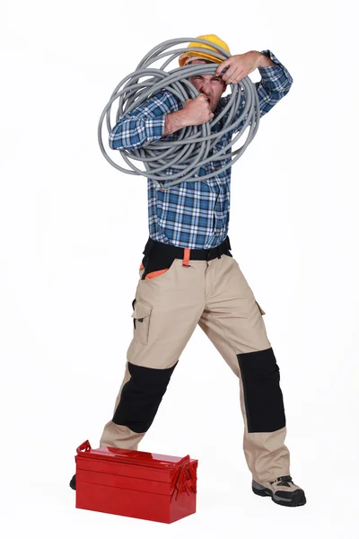 Artisan holding cable — Stock Photo, Image