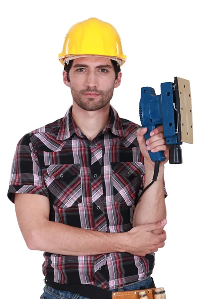 Porträtt av en elektriker som innehar en slipmaskin — Stockfoto