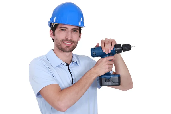 Man with helmet and drill — Stock Photo, Image