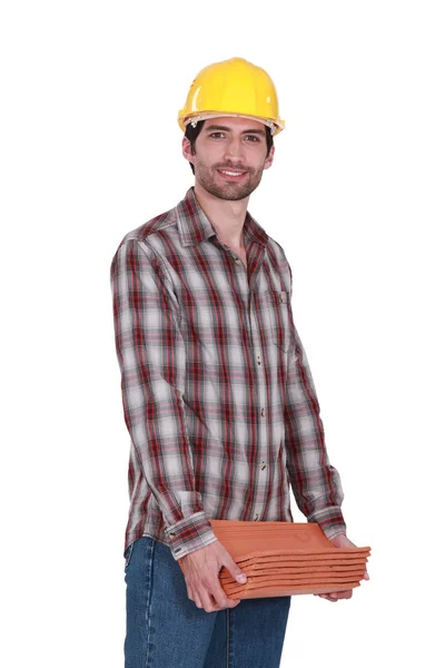 Tradesman carrying shingles — Stock Photo, Image