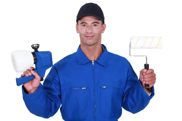 Man with a roller and paint gun — Stock Photo, Image