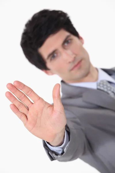 Empresário fazendo um sinal de parada com a mão — Fotografia de Stock