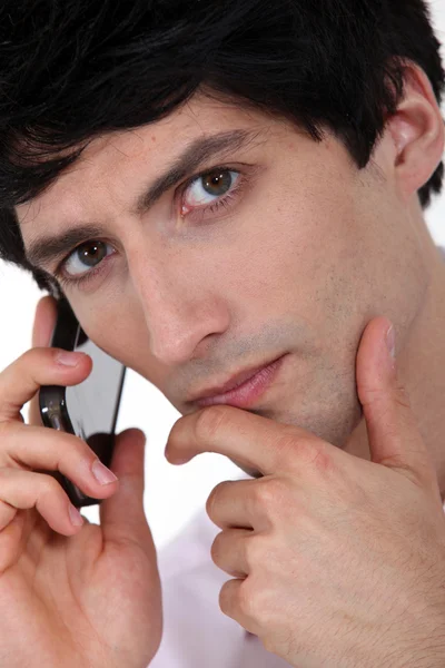 Serious man with a mobile phone — Stock Photo, Image
