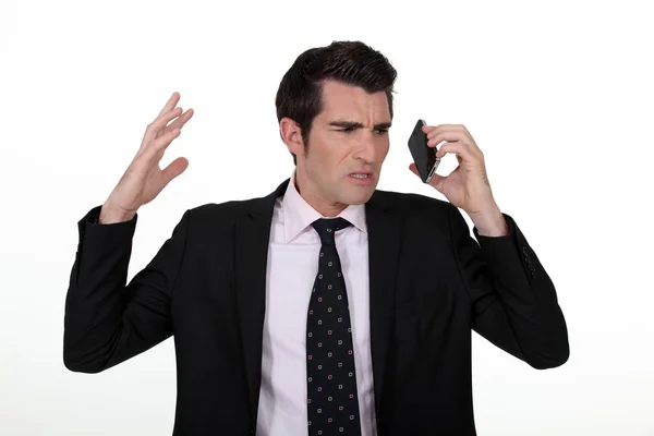 An angry businesswoman over the phone. — Stock Photo, Image