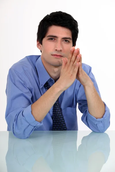 Businessman with his hands pressed together — Stock Photo, Image