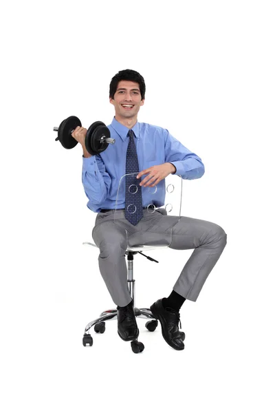 Businessman lifting weights — Stock Photo, Image