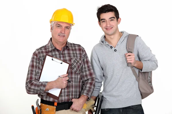 Builder welcoming trainee Royalty Free Stock Photos