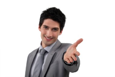 Portrait of a welcoming businessman clipart