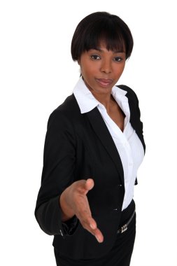 Businesswoman proffering her hand clipart