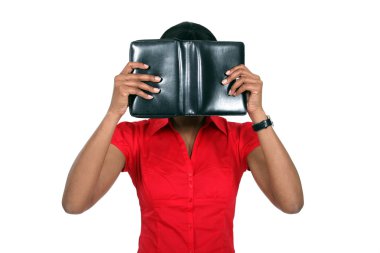 Woman hiding her face behind a leather-bound book clipart