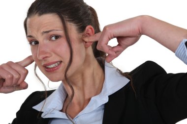 Woman plugging her ears clipart