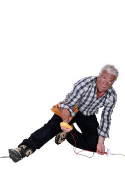 Electrician falling down after an electrical shock clipart