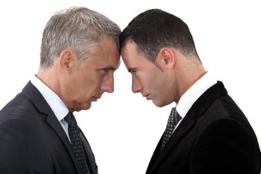 Tension between two businessmen clipart