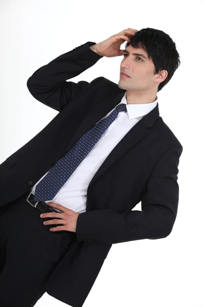 Young businessman scratching head — Stock Photo, Image