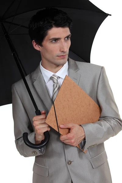 Businessman with an umbrella — Stock Photo, Image
