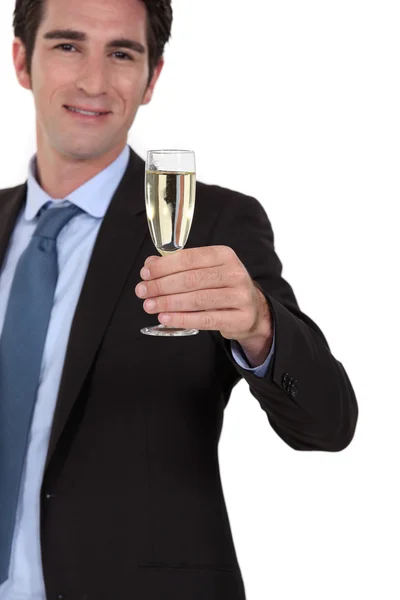 Businessman drinking champagne alone — Stock Photo, Image