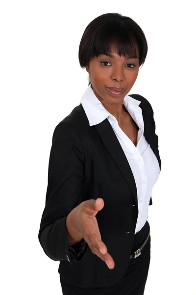 Businesswoman proffering her hand — Stock Photo, Image