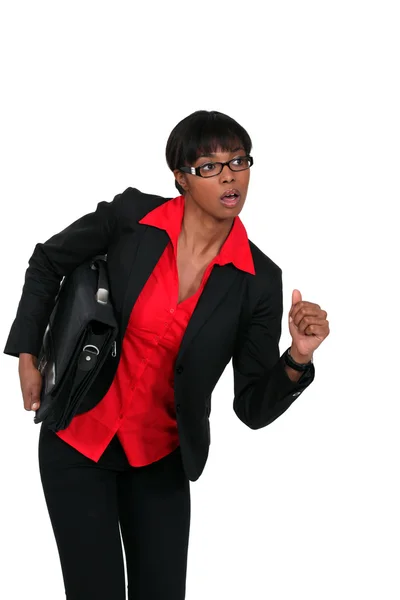 Businesswoman with briefcase about to run — Stock Photo, Image