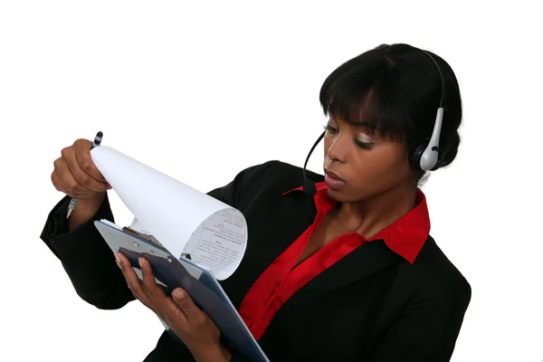 Call-center worker with clip-board — Stock Photo, Image