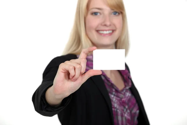 Young businesswoman holding a visit card — Stock Photo, Image