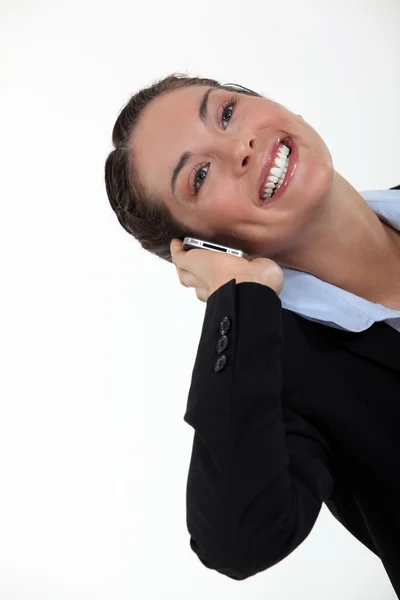 Excited brunette receiving an important call — Stock Photo, Image