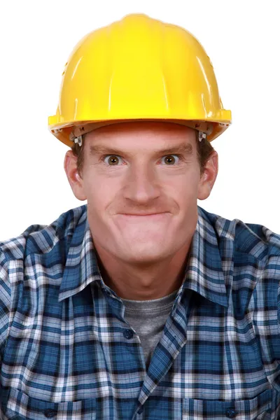 Tradesman fazendo uma cara boba — Fotografia de Stock