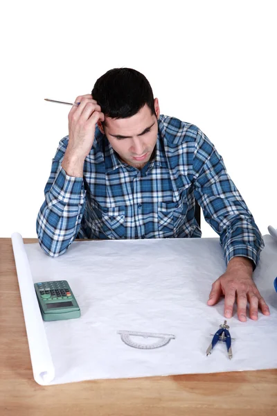 Draughtsman working on a new drawing — Stock Photo, Image