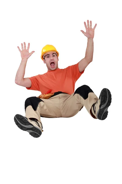 Tradesman falling backwards — Stock Photo, Image