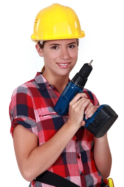 Hezká dívka drží elektrický šroubovák — Stock fotografie