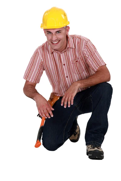 Portrait of a craftsman to his knees on the floor — Stock Photo, Image