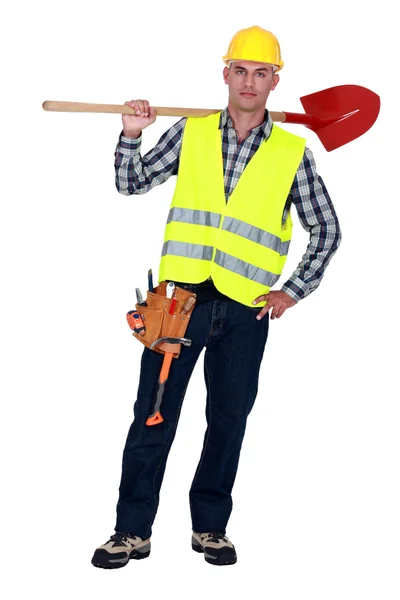 Arbeider uitvoering een spade — Stockfoto
