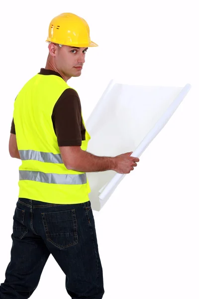 Artesanato segurando uma planta — Fotografia de Stock