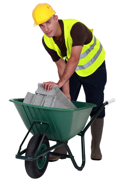 Laborer with a wheelbarrow — Stock Photo, Image