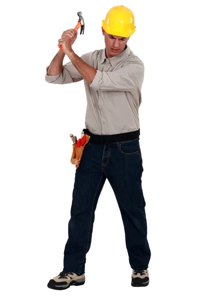 Craftsman striking with a hammer — Stock Photo, Image