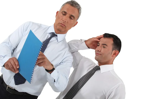 Businessmen looking at document — Stock Photo, Image