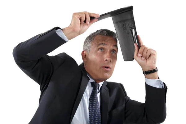 Businessman shielding himself with folder — Stock Photo, Image