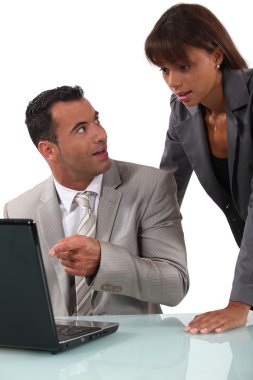 Shocked colleagues reading an e-mail message clipart